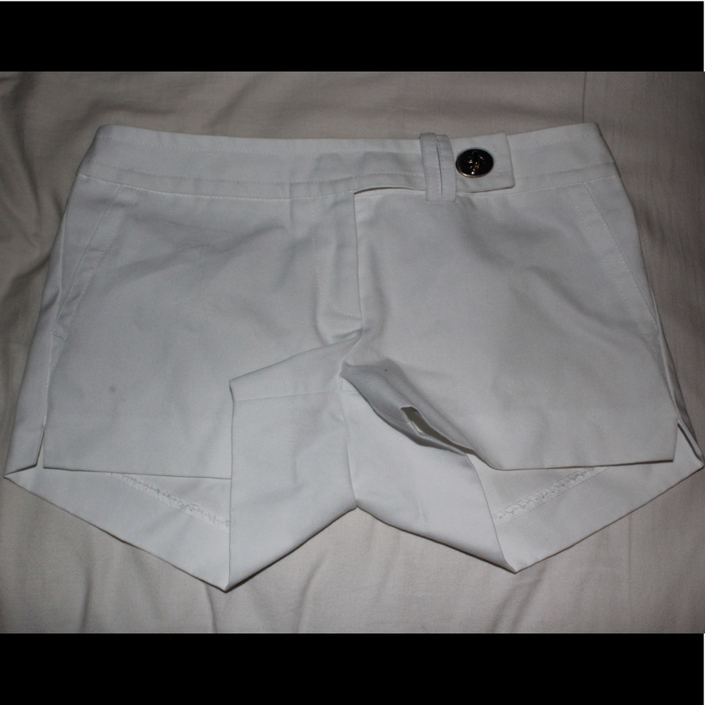 White shorts with turn lock detail